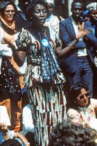 African woman, arms outspread, and shouting, Nairobi, 1985. International Women's Tribune Centre Slide Show, NGO Forum, Nairobi