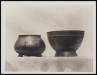 2 bowl shaped metal vases