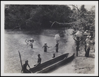 [4 people crossing ford, 2 carrying supplies on heads, 3 people on the bank and 3 sitting on a wooden dugout boat (Another copy)