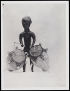 1 figurine playing 2 drums
