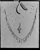 jewellery; necklace of amulets and silver cross