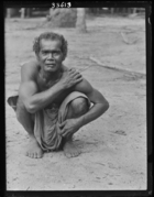 Curly-haired man from village of Ban-Sai Kau.