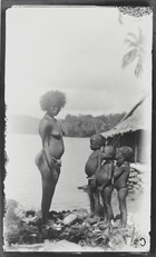 A woman and three children at Sychele on Rubiana Lagoon, New Georgia Island.