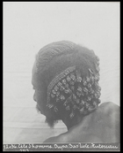 back of mans head showing elaborately plaited hair