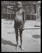 child standing in front of stockade
