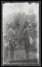 Two women and a child standing; profile; Rubiana Lagoon, New Georgia Island.