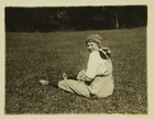 Photograph of Woman Farm Worker Taking a Break in a Field