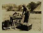 Photograph of an army cook preparing vegetables