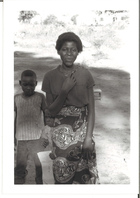 Black and White photograph of a woman and two young children
