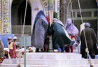 At the Shrine of Hazarat Ali: Women asking for blessing at the flagpole of Ali